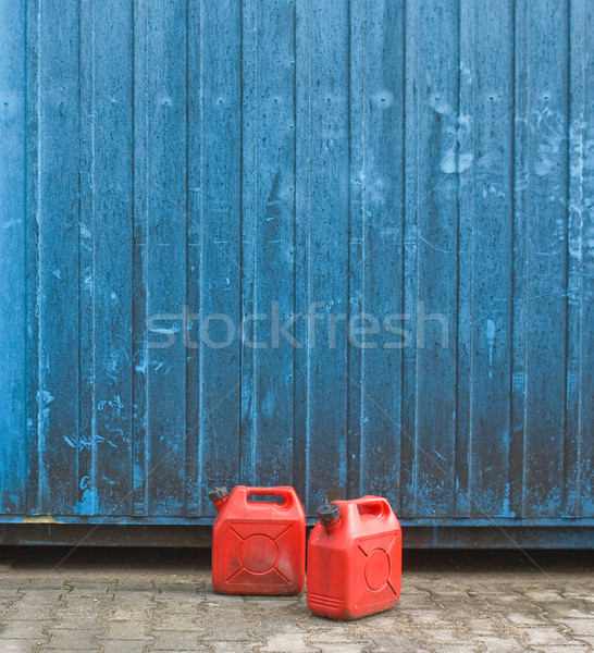 Dwa czerwony benzyny niebieski pojemnik ściany Zdjęcia stock © pixpack