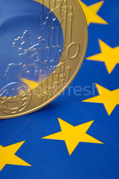 Euro coin on a european flag Stock photo © pixpack