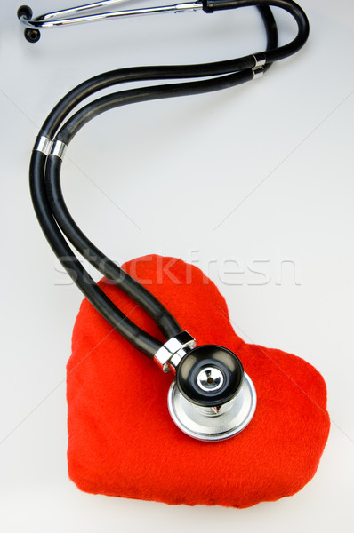 Red fabric heart with a stethoscope Stock photo © pixpack