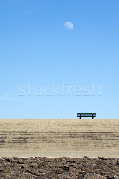 Lonely bench on a concrete dyke Stock photo © pixpack