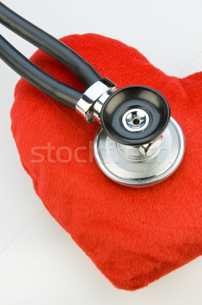 Stethoscope on a red fabric heart Stock photo © pixpack