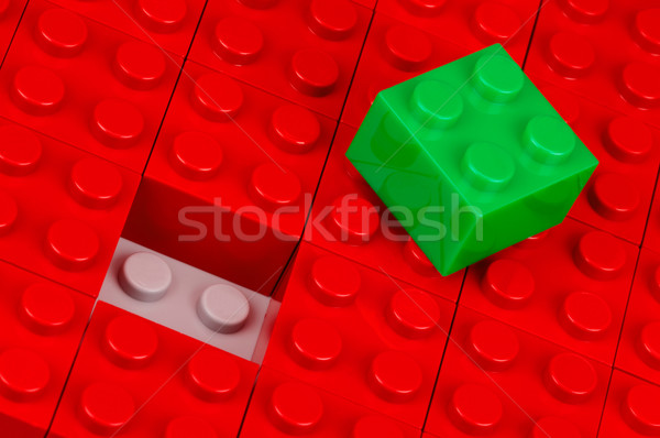 Green building block on red one Stock photo © pixpack