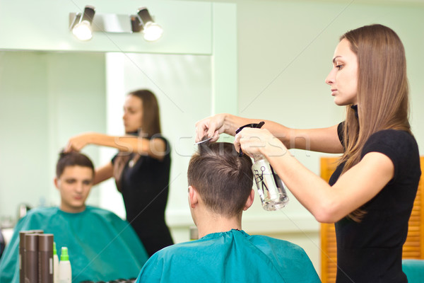 Hairdresser dries the hair guy Stock photo © podsolnukh
