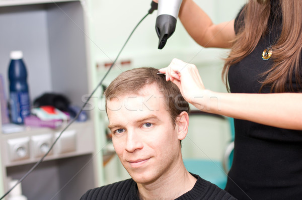 Hairdresse dry guy hair Stock photo © podsolnukh