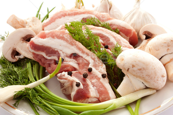 Raw meat with mushrooms, spices and herbs Stock photo © podsolnukh