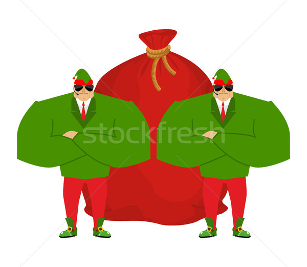 Santa elf and red bag. Claus bodyguards. Christmas guards. Prote Stock photo © popaukropa