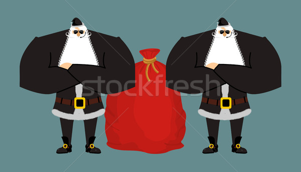 Santa Claus bodyguards. Christmas security guards. Protecting re Stock photo © popaukropa