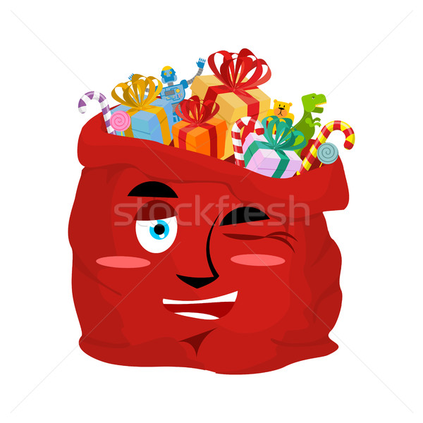Santa bag winks Emoji. Christmas sack with gifts merry emotion.  Stock photo © popaukropa
