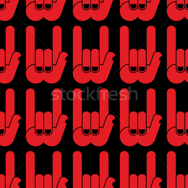 Rock hand sign seamless pattern. Black background and red hands. Stock photo © popaukropa