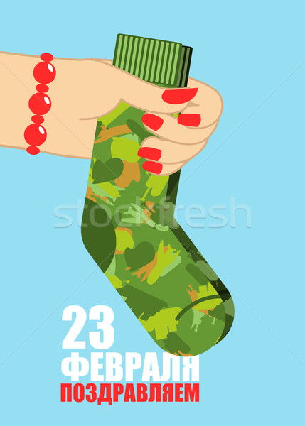 February 23. Female hand to give socks. Traditional gift for mil Stock photo © popaukropa