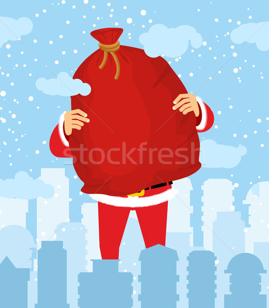 Santa Claus in city carry bag of gifts. Christmas in town. Snow  Stock photo © popaukropa