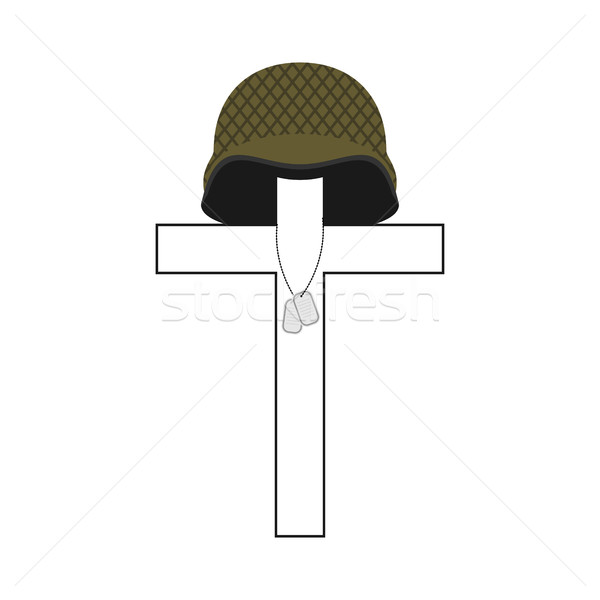 Grave of soldier. Cross and military helmet. Soldier badge. Patr Stock photo © popaukropa