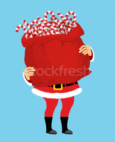 Santa Claus and bag of Christmas peppermint lollipop. Christmas  Stock photo © popaukropa