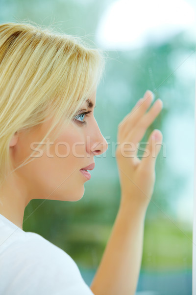 Woman by the window Stock photo © pressmaster