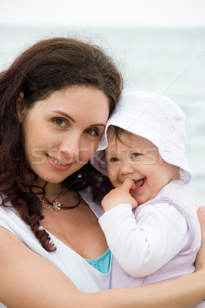 óvatos anya kép csinos nő tart kicsi Stock fotó © pressmaster