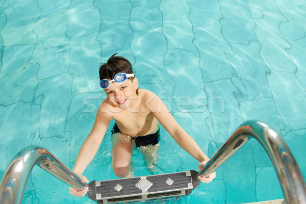 Boy in pool Stock photo © pressmaster