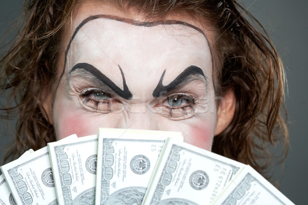 Finansowych zło malowany twarz za kilka Zdjęcia stock © pressmaster