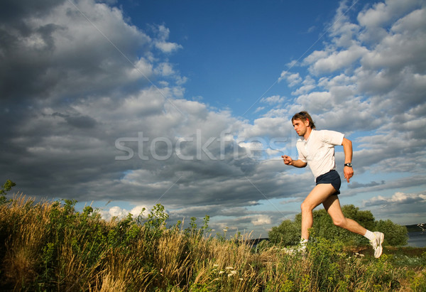 Sportu szkolenia Fotografia silne człowiek uruchomiony Zdjęcia stock © pressmaster