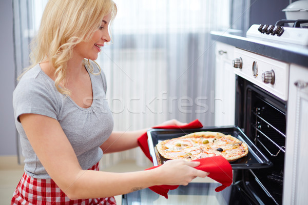 Cooking pizza Stock photo © pressmaster