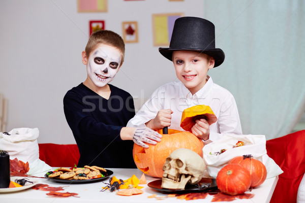 Stock photo: Cutting pumpkin