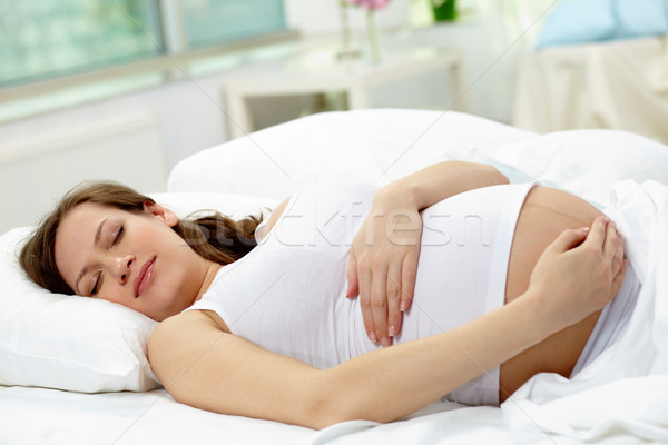 Slapen schoonheid zwangere jonge vrouw liefde gelukkig Stockfoto © pressmaster