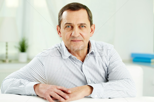 Homme mûr portrait regarder caméra séance canapé [[stock_photo]] © pressmaster