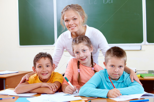 Teacher and schoolkids Stock photo © pressmaster