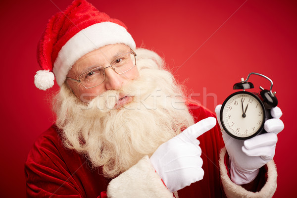 śpieszyć się christmas Święty mikołaj wskazując zegar Zdjęcia stock © pressmaster