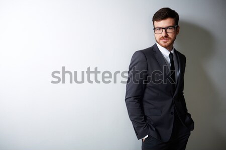 Homme costume jeunes affaires lunettes regarder [[stock_photo]] © pressmaster