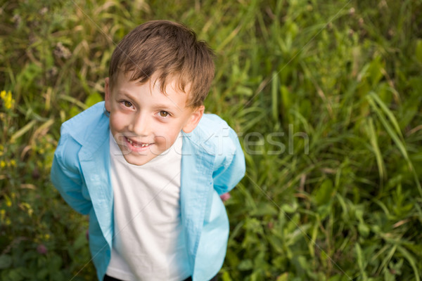 Feliz rapaz acima tiro em pé Foto stock © pressmaster