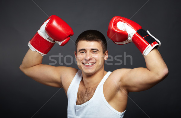 Champion portrait heureux jeune homme rouge gants de boxe [[stock_photo]] © pressmaster