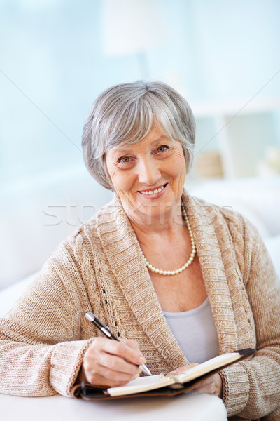 Készít jegyzetek portré kopott női jegyzettömb Stock fotó © pressmaster