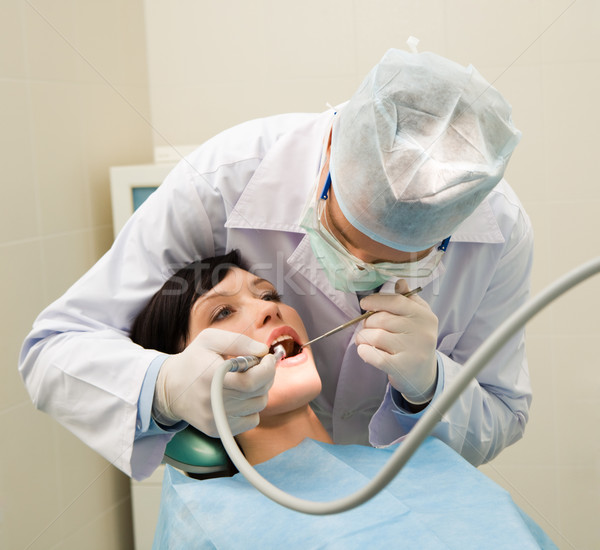 Oral foto dentista uniforme examinar cavidad Foto stock © pressmaster