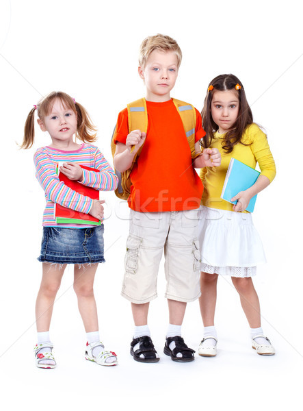 Gruppe Schulkinder isoliert weiß schauen Freunde Stock foto © pressmaster