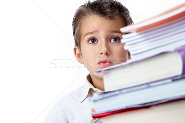 Uwaga Fotografia młodzik patrząc książki edukacji Zdjęcia stock © pressmaster