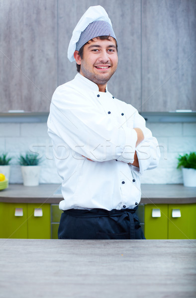 Culinária especialista retrato homem bonito cozinhar uniforme Foto stock © pressmaster