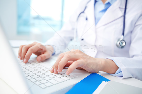 Clinician typing Stock photo © pressmaster