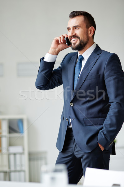 Negocios llamada sonriendo empresario traje Foto stock © pressmaster