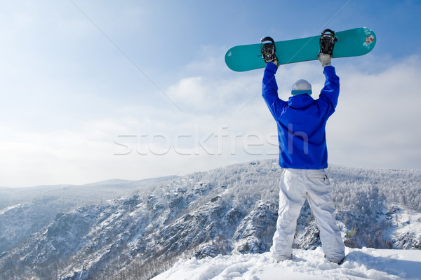 Triumf widok z tyłu sportowiec snowboard stałego górę Zdjęcia stock © pressmaster