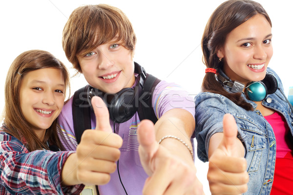 Cool cute tieners hoofdtelefoon tonen Stockfoto © pressmaster