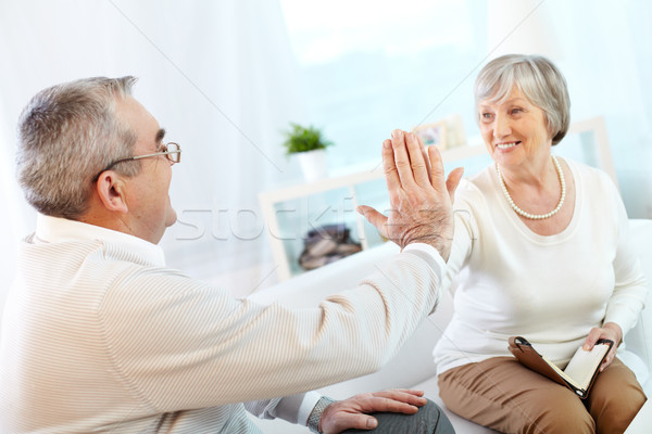Portrait of a happy senior couple keeping their palms in touch Stock photo © pressmaster