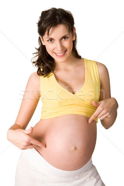 Pointant ventre photo joli femme enceinte regarder Photo stock © pressmaster