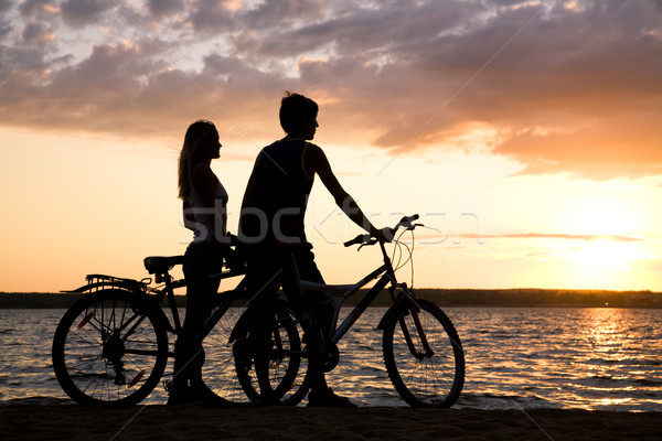 Stock foto: Schönen · Sonnenuntergang · stehen · Fahrräder · Meer