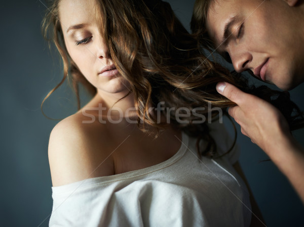 Szag kedvesem fiatalember élvezi haj nő Stock fotó © pressmaster