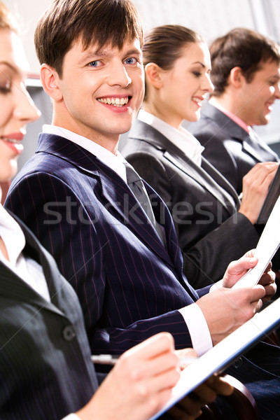 Seminarium portret uśmiechnięty człowiek posiedzenia koledzy Zdjęcia stock © pressmaster