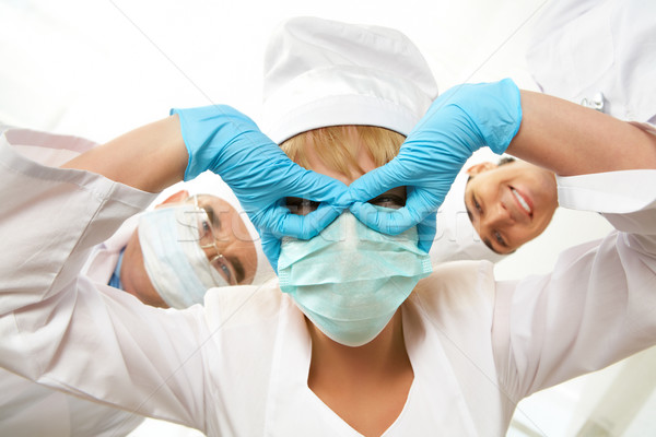 Witzig Krankenschwester Bild Maske Hände Augen Stock foto © pressmaster