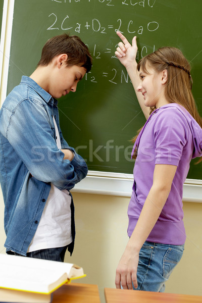 Toelichting formule knap meisje wijzend Blackboard Stockfoto © pressmaster
