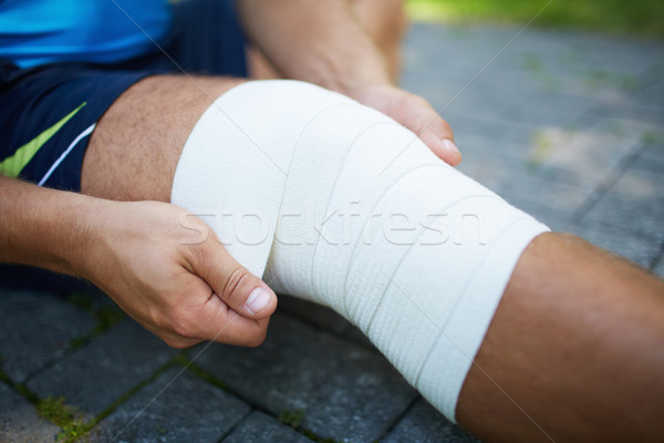 Stock photo: Bandaging leg