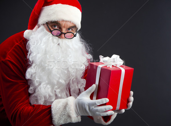 Santa with present Stock photo © pressmaster