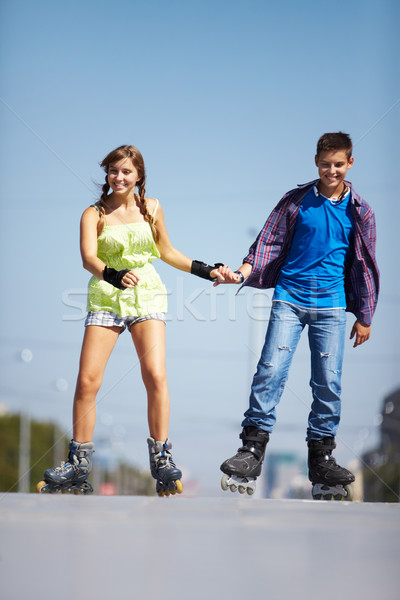 Couple of roller skaters Stock photo © pressmaster